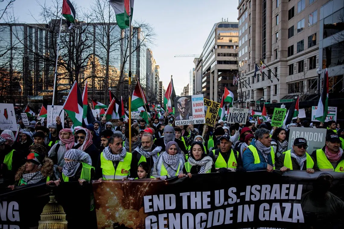 Pro-Palestine demonstrators march through the streets during a rally on Jan 13 in Washington, DC. 