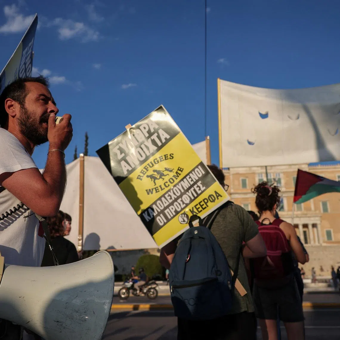 Pro-migrant and anti-racism groups protest in front of the Greek parliament, ahead of the vote on a bill which speeds up deportation of rejected asylum seekers and provides for their transfer to \"return hubs\" , in Athens, Greece, June 9, 2026. REUTERS/Louisa Gouliamaki