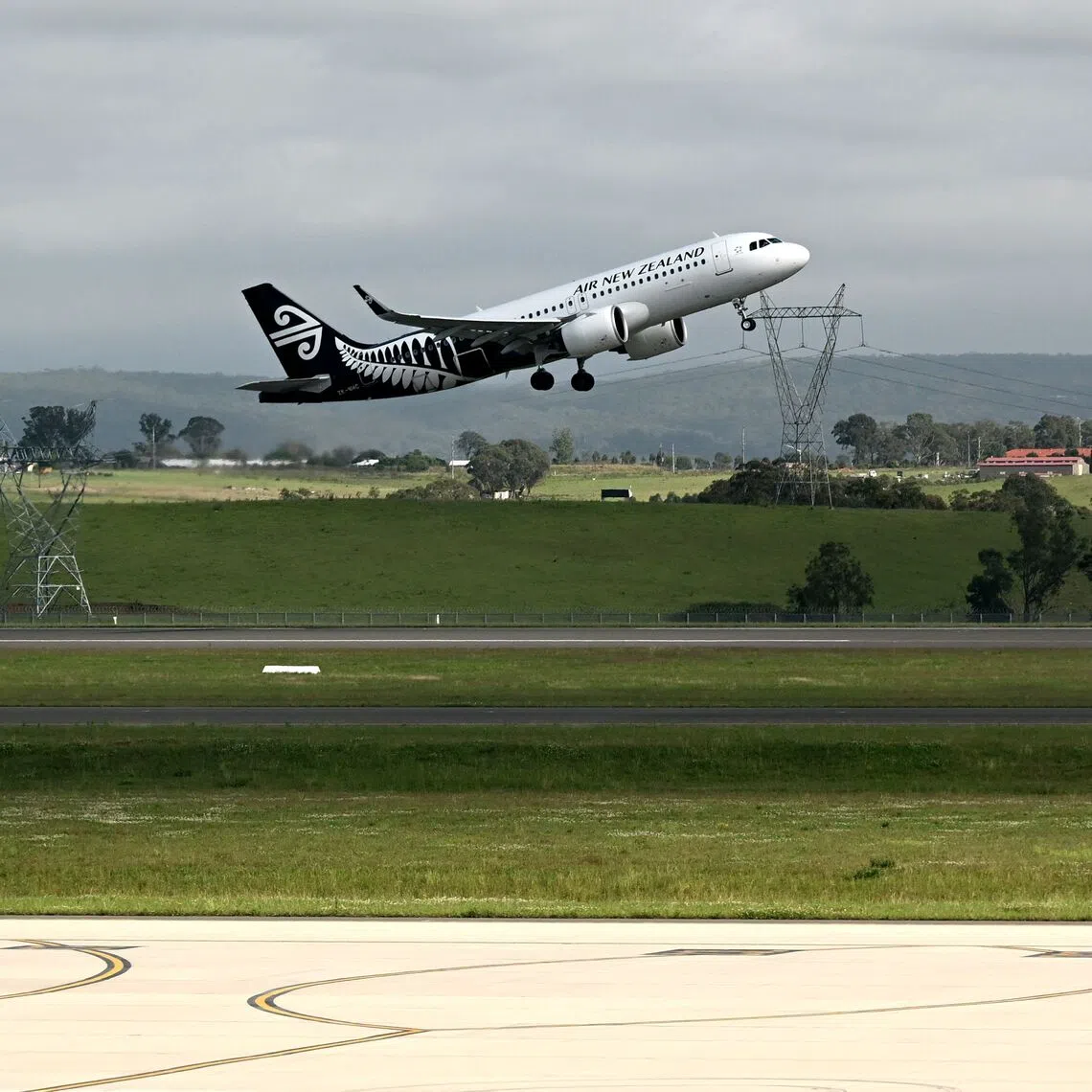 An Air New Zealand plane taking off as the first international flight to depart the newly opened Western Sydney International Airport on Oct 26.