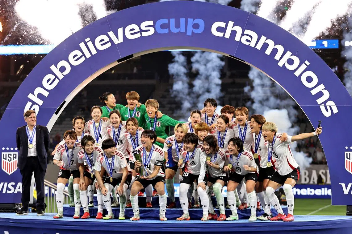 Feb 26, 2025; San Diego, California, USA; Japan celebrates on stage with their awards as the champions of the SheBelieves Cup at Snapdragon Stadium. Mandatory Credit: Julia Kapros-Imagn Images