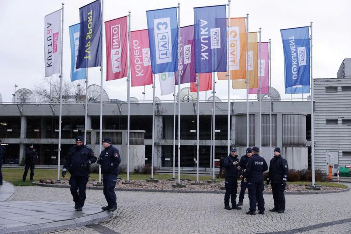 FILE PHOTO: Police stand outside the television building as protesters and Law and Justice politicians gather inside the headquarters after the management of Polish public television, radio and news agency PAP have been dismissed by new culture minister in Warsaw, Poland, December 20, 2023. Dawid Zuchowicz/Agencja Wyborcza.pl via REUTERS/ FILE PHOTO