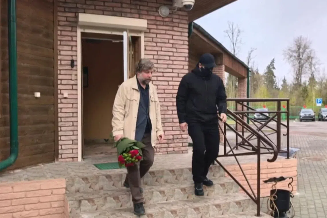 Russian archaeologist Alexander Butyagin walks after being released by Poland as part of a prisoner swap at the Pererov-Bialowieza border checkpoint in the Brest region, Belarus, April 28, 2026, in this still image taken from video. Belteleradiocompany/Handout via REUTERS