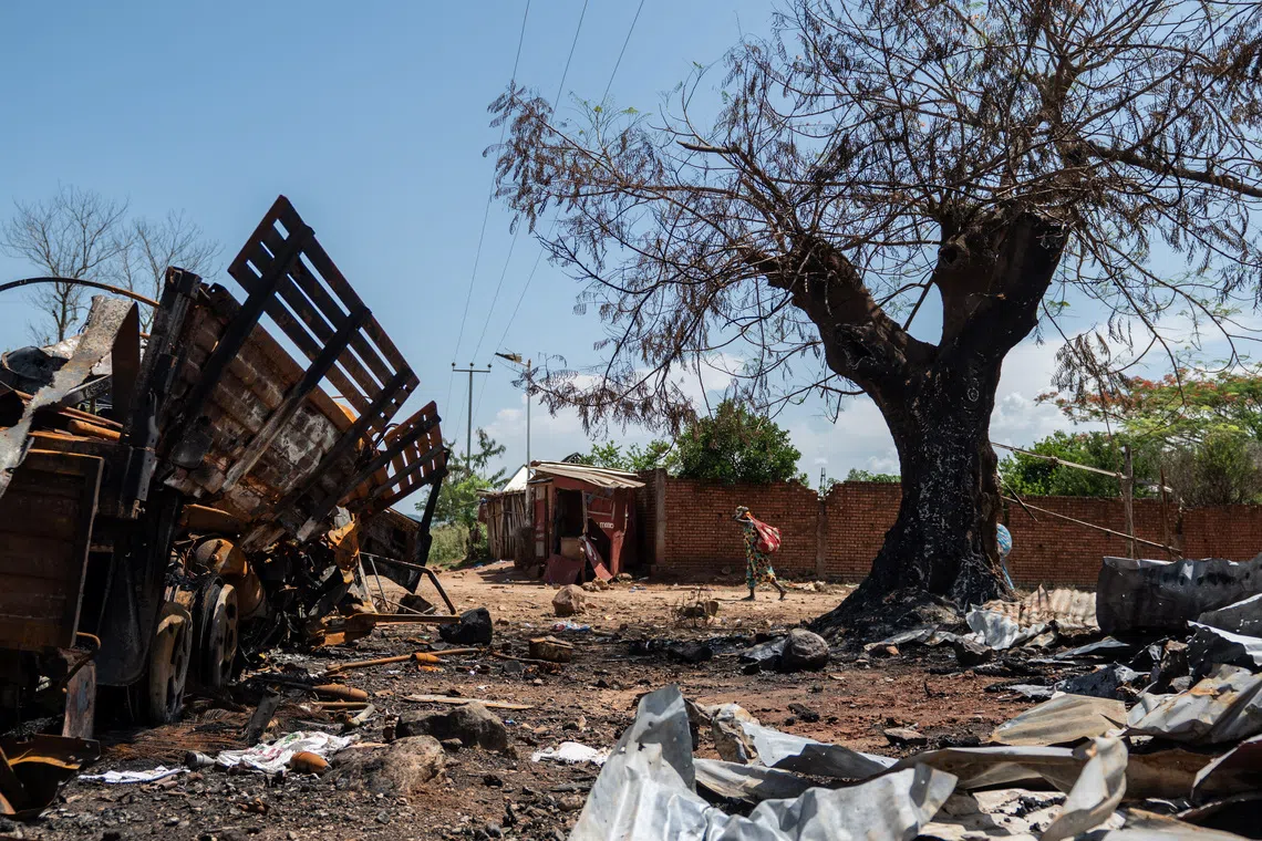 A suspected Burundian military vehicle destroyed during renewed clashes between Alliance Fleuve Congo AFC/M23 and the Armed Forces of the Democratic Republic of the Congo (FARDC), sits along the National Road No. 5 in Luvungi, a settlement north of Uvira; South Kivu province, in the Democratic Republic of Congo December 13, 2025. REUTERS/Stringer