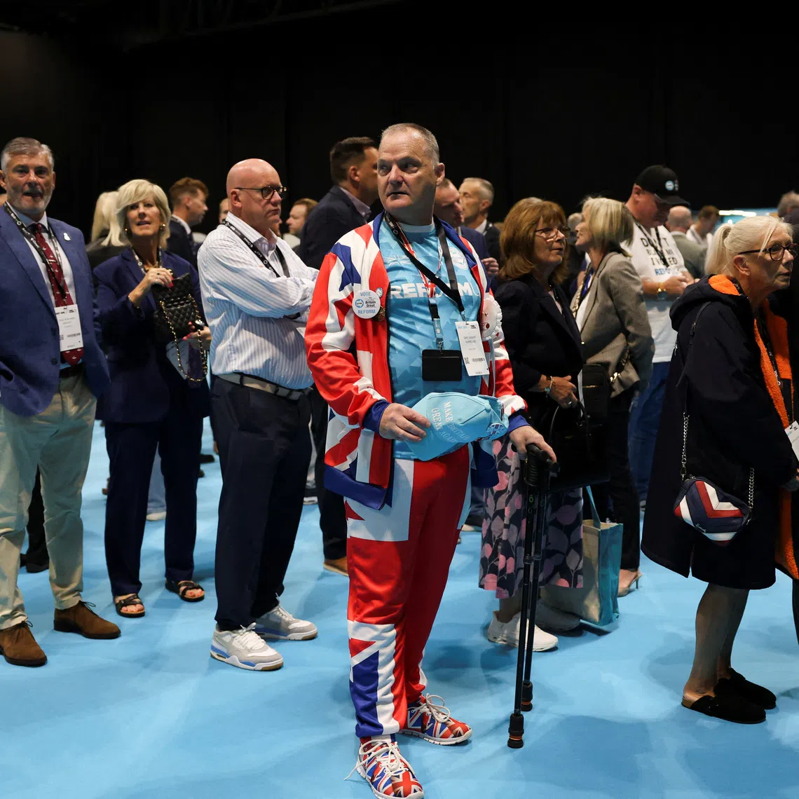 A delegate wearing a Union Jack-themed suit attends the annual Reform UK party conference, in Birmingham, Britain.