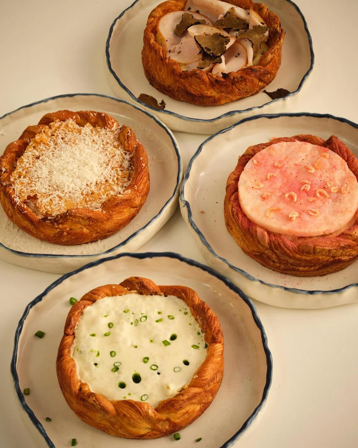 Elijah Pies’ new pizza pies with a croissant-style crust.