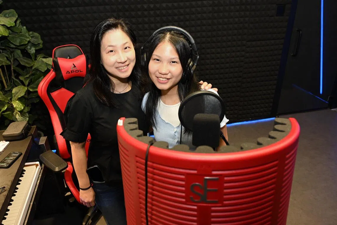 Aspiring songstress Lorraine Sugandi, 14, (right) and her mother Ms Indayani Sudargo, 46 (left) at a recording studio inside local performing arts school Maddspace.