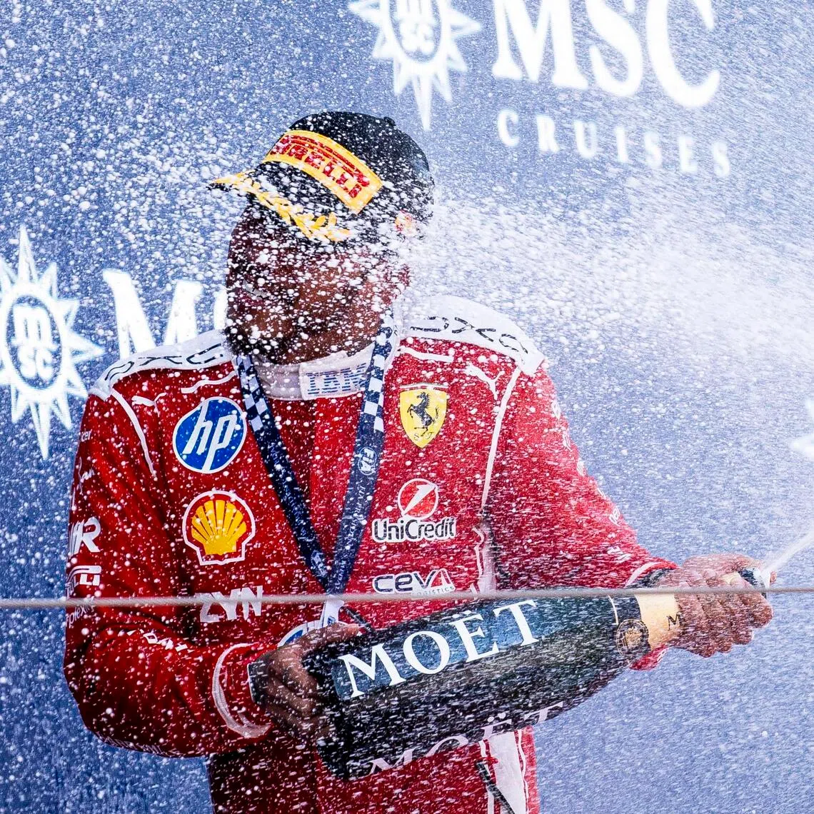 Ferrari driver Lewis Hamilton celebrates on the podium after the Formula 1 Grand Prix of Barcelona-Catalunya.