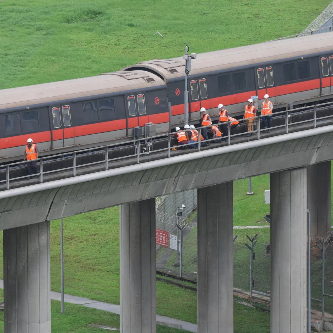 SMRT personnel inspecting the carriages of the affected train outside Ulu Pandan Depot at around 1.45pm on Sept 25, 2024.