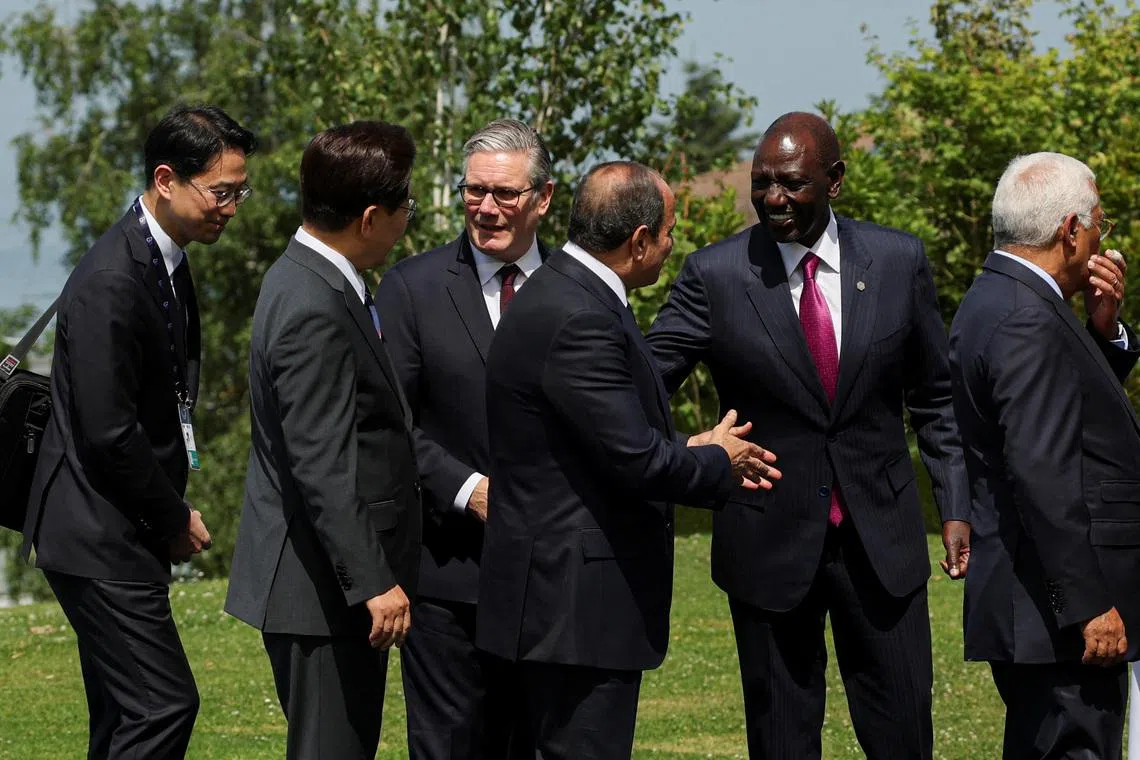 British Prime Minister Keir Starmer, South Korea's President Lee Jae Myung, Kenya's President William Ruto and Egyptian President Abdel Fattah al-Sisi, interact after posing for a family photo during the G7 summit, in Evian-les-Bains, France, June 16, 2026. REUTERS/Isabel Infantes/Pool