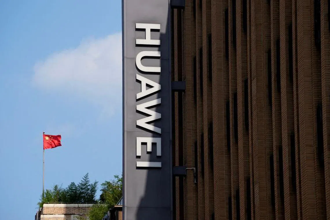 FILE PHOTO: A Chinese flag flutters near a Huawei store in Shanghai, China, Sept. 8, 2023. REUTERS/Aly Song/File Photo