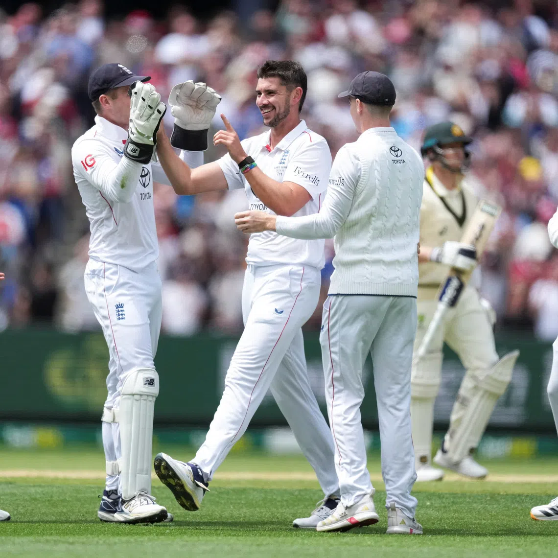 Cricket - The Ashes - Australia v England - Fourth Test -  MCG, Melbourne, Australia - December 26, 2025 England's Josh Tongue reacts after getting the wicket of Australia's Steve Smith.   REUTERS/Asanka Brendon Ratnayake