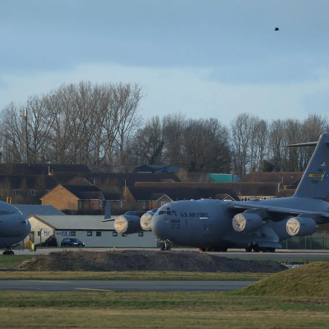 U.S. Air Force C-17 Globemaster III aircraft are parked at RAF Fairford airbase, Fairford, Britain, January 7, 2026. REUTERS/Toby Melville