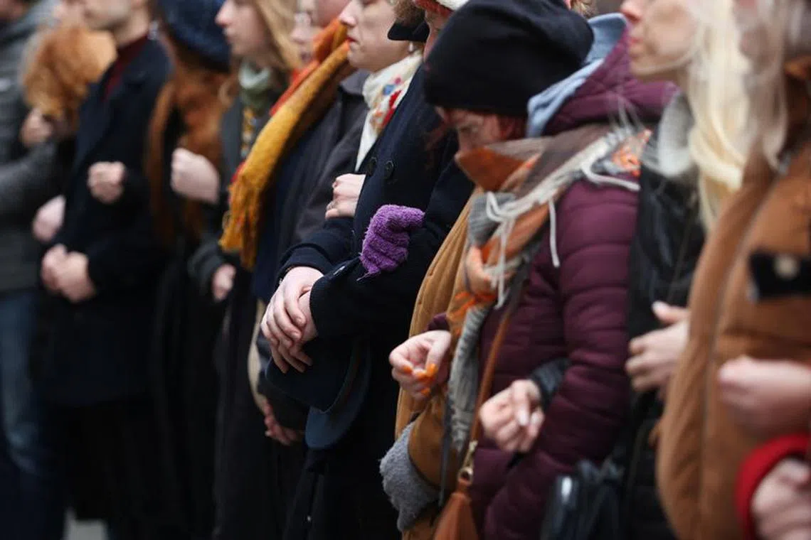 Students create a human chain in memory of victims of the shooting at Prague University, Prague, Czech Republic, January 4, 2024. REUTERS/Eva Korinkova