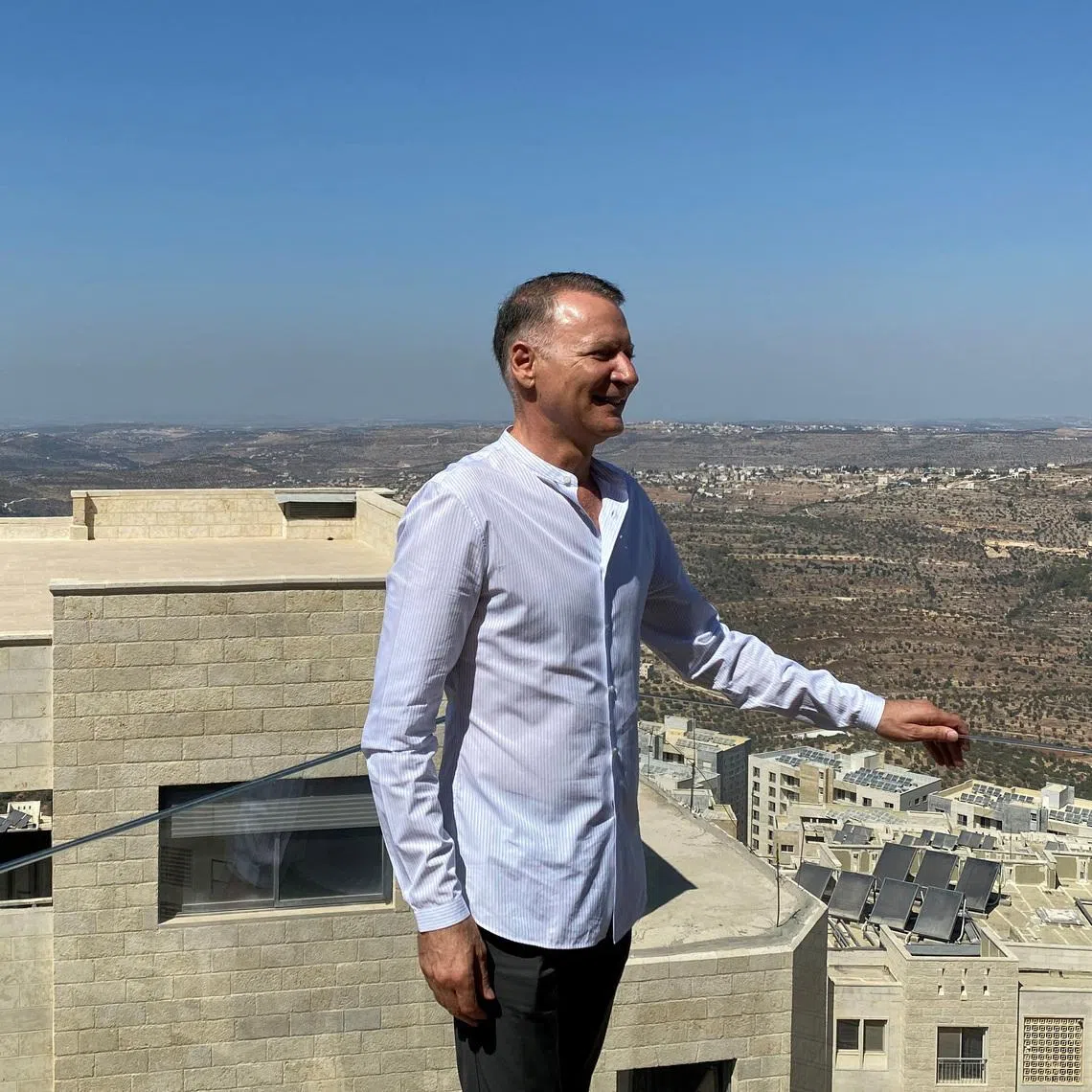 Bashar Masri, a prominent Palestinian businessman and founder of Rawabi, the first planned Palestinian city in the West Bank, poses during an interview with Reuters in Rawabi, October 5, 2020. REUTERS/Rami Ayyub/File Photo