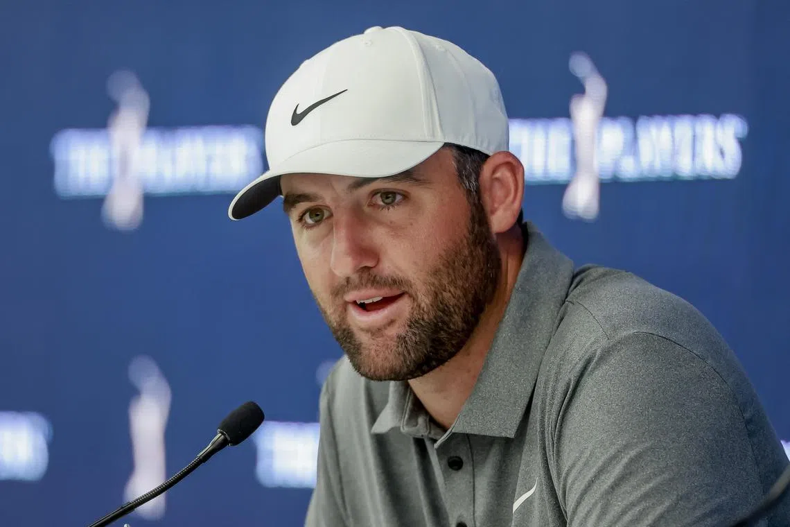 Defending champion Scottie Scheffler responds to a question during a press conference for The Players Championship.