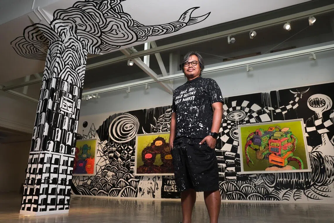 Indonesian artist Eko Nugroho at his exhibition, titled Strange Monster View, at STPI, a print and paper gallery and workshop in Robertson Quay.