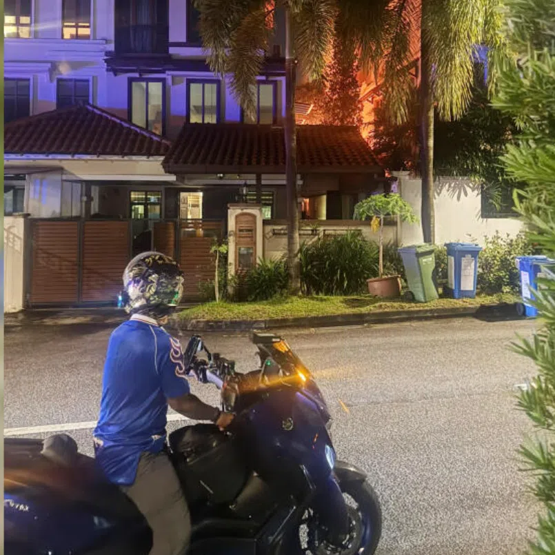 A photo taken at the scene shows bright, orange flames reaching up to the third storey of the terraced unit.