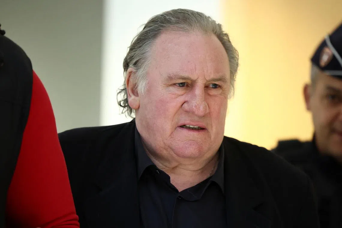 FILE PHOTO: French actor Gerard Depardieu arrives at the courthouse, as his trial over accusation of sexual assault of two women, which prosecutors say took place during the filming of \"Les Volets Verts\", continues in Paris, France, March 27, 2025. REUTERS/Abdul Saboor/ File Photo