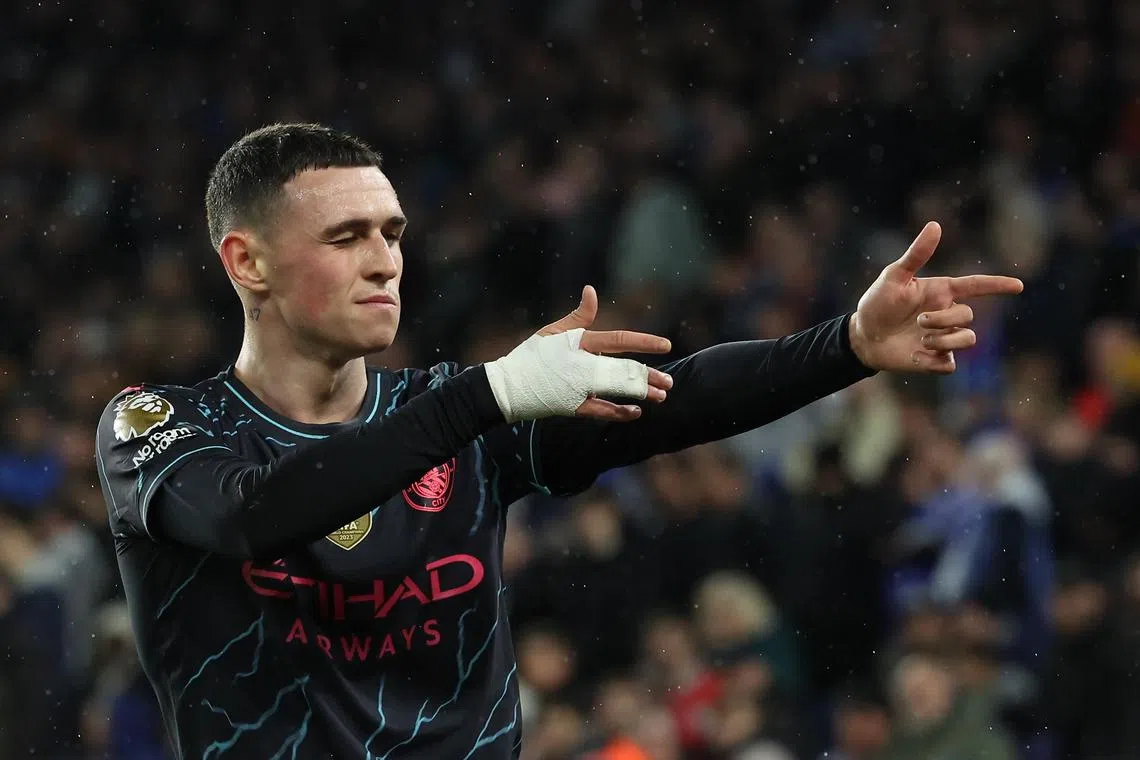 Manchester City's Phil Foden celebrates scoring their third goal.