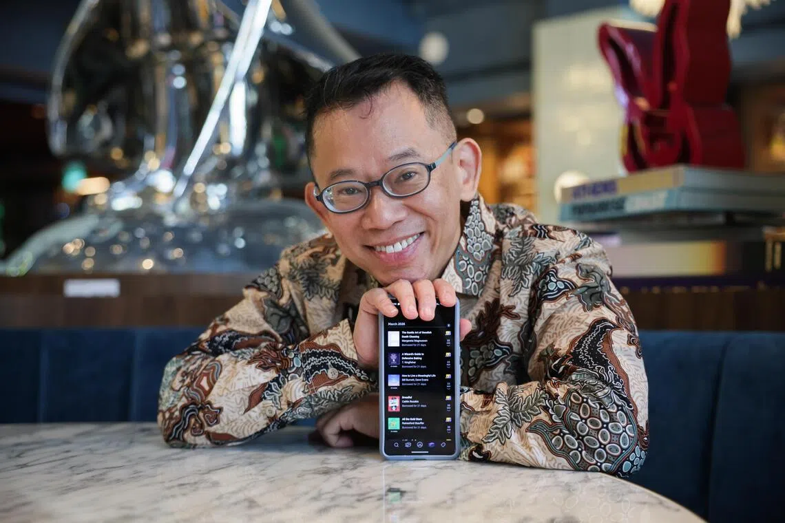 Mr Jason Leow shows his library on the Libby app, where he accesses most of his audiobooks and e-books.