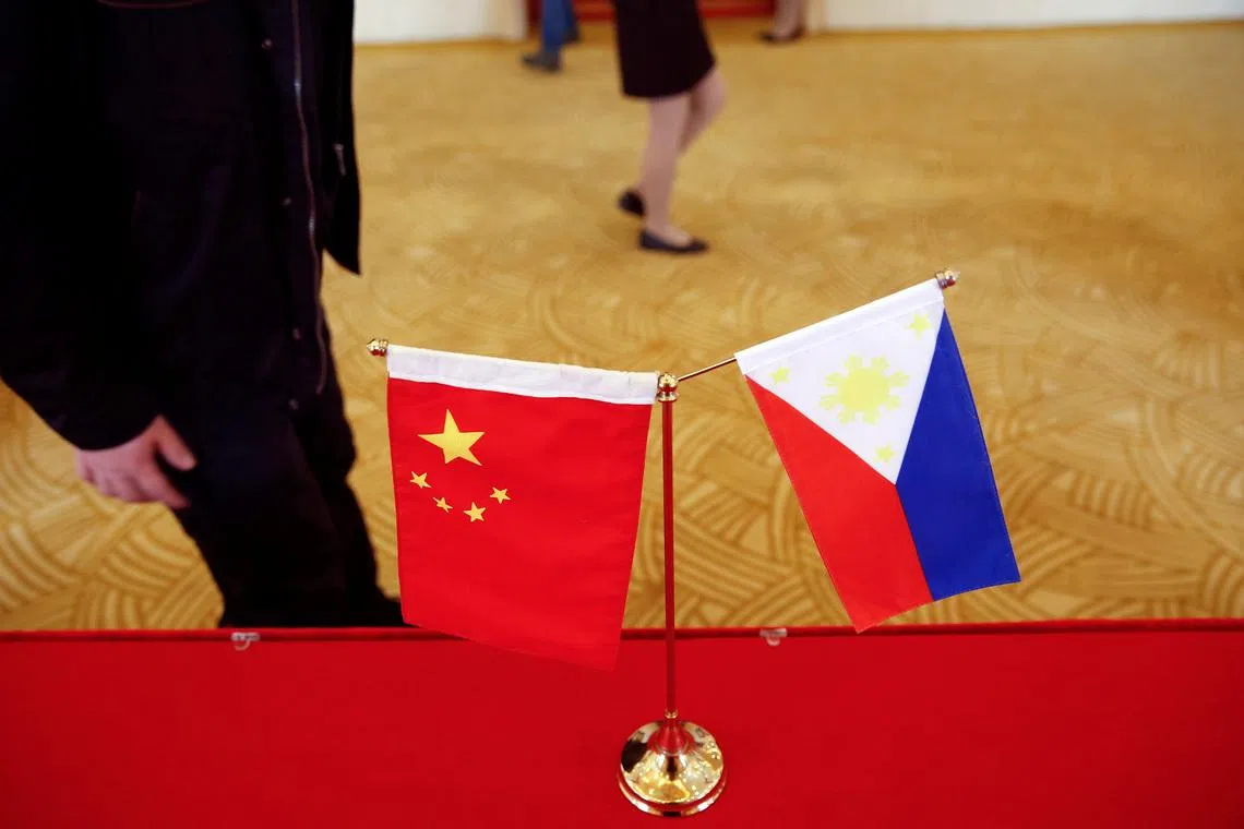 FILE PHOTO: National flags of China and the Philippines are seen in Beijing, China, January 23, 2017. REUTERS/Damir Sagolj/File Photo