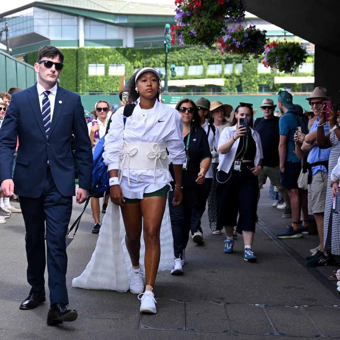 Tennis - Wimbledon - All England Lawn Tennis and Croquet Club, London, Britain - July 1, 2026 Japan's Naomi Osaka walks to the court ahead of her second round match against Russia's Anastasia Gasanova REUTERS/Jaimi Joy