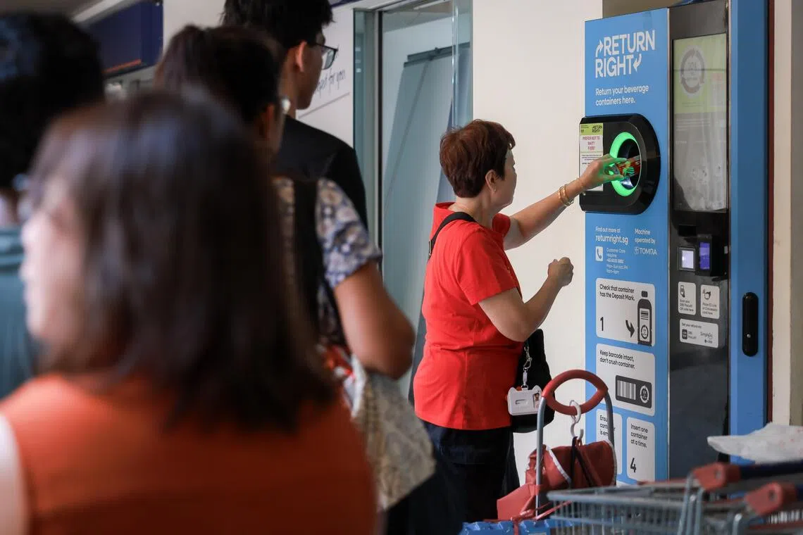 A line of people using the Return Right machine at Toa Payoh Central.