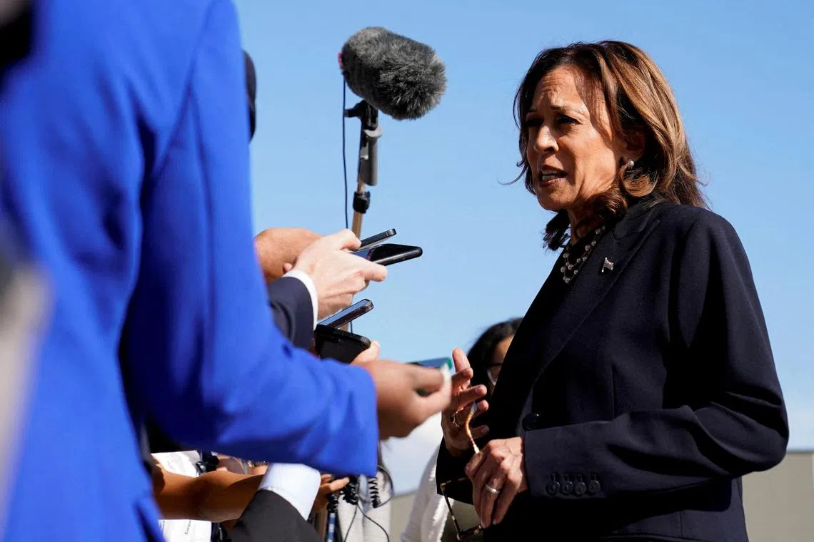 US Vice-President and Democratic presidential candidate Kamala Harris speaking with members of the media before boarding Air Force Two at Detroit Metropolitan Wayne County Airport in Romulus, Michigan on Aug 8. 