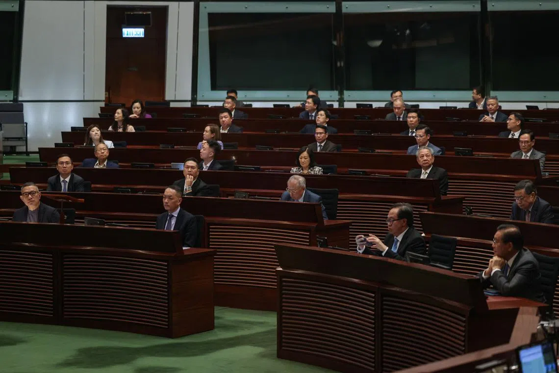 Legislators vote on the registration of same-sex partnerships bill, which allows couples registered abroad to register locally, in the Legislative Council chamber, in Hong Kong, China, September 10, 2025. REUTERS/Tyrone Siu