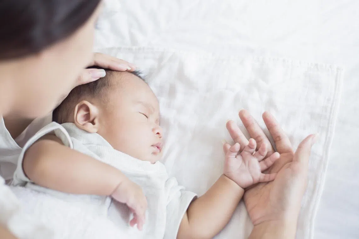 Mother Checks The Temperature Of A Sick Baby, newborn baby had a fever. Healthcare medical motherâs day concept.