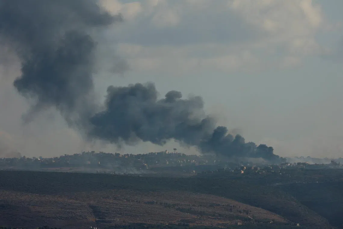 Smoke billows over southern Lebanon following Israeli strikes, amid ongoing cross-border hostilities between Hezbollah and Israeli forces, as seen from Tyre, southern Lebanon September 23, 2024 REUTERS/Aziz Taher/ File Photo