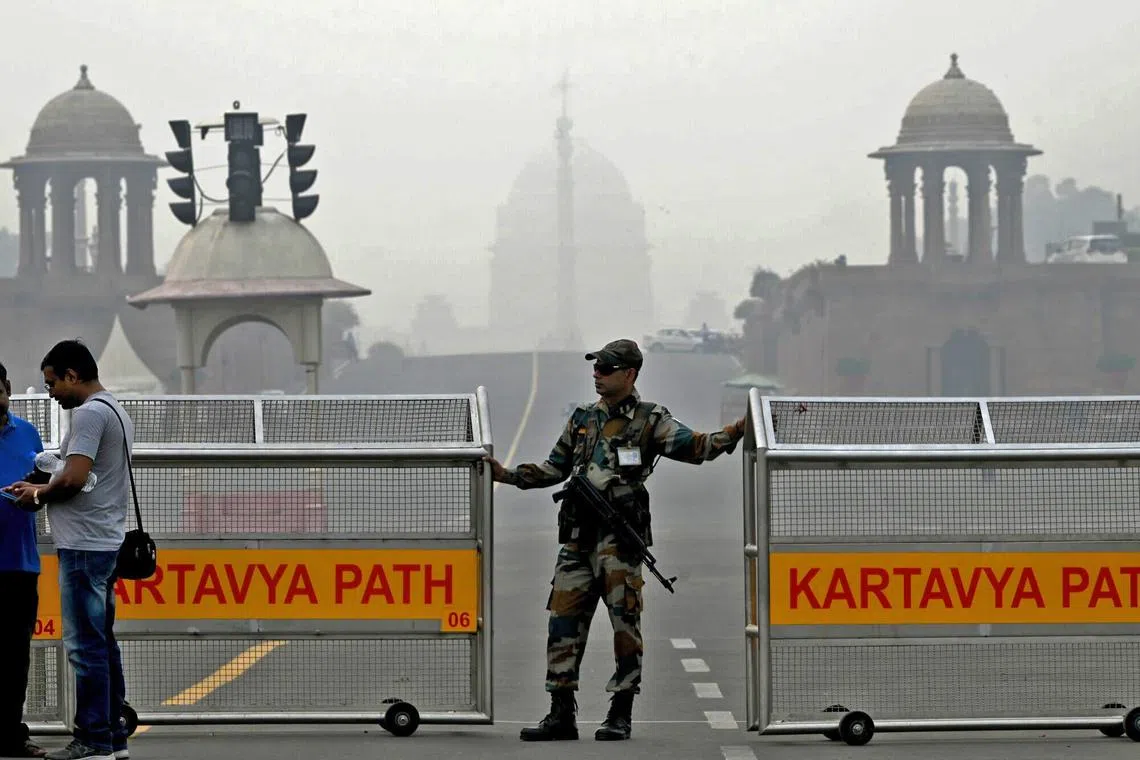 A security personnel standing guard on Kartavya path amid heavy smog in New Delhi, India, on Nov 4, 2023. 