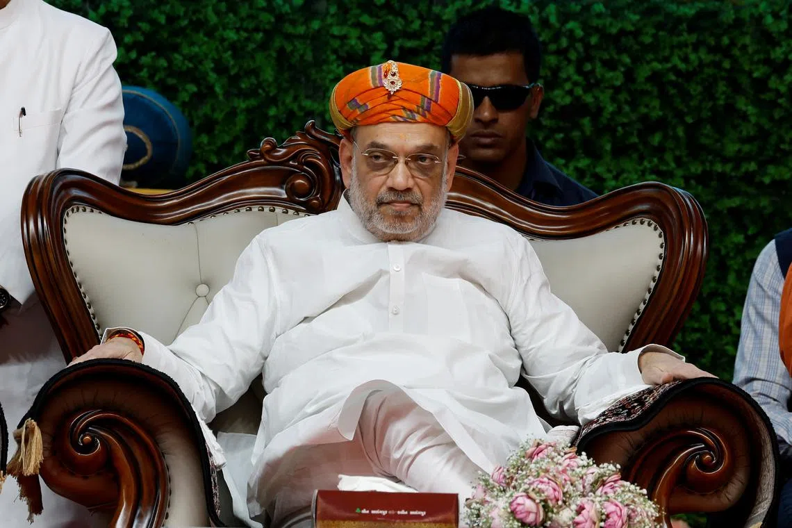 FILE PHOTO: India's Home Minister Amit Shah attends an inauguration ceremony of Gopalanand Swami Yatrik Bhavan at a temple premises in Salangpur, in the western state of Gujarat, India, October 31, 2024. REUTERS/Amit Dave/File Photo