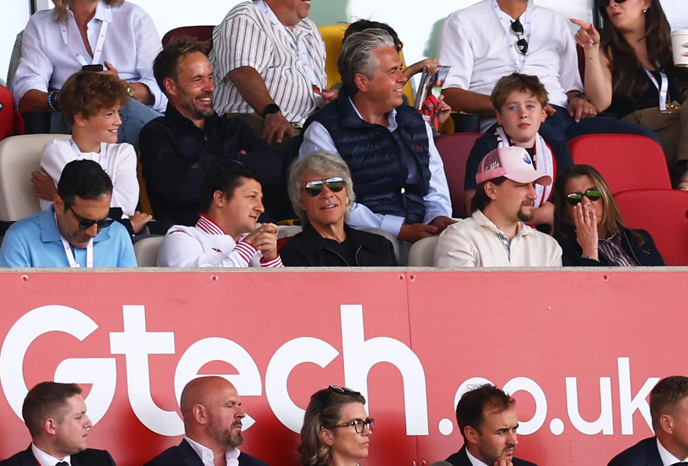 US singer Jon Bon Jovi (centre) in the stands for the Aug 22 match.