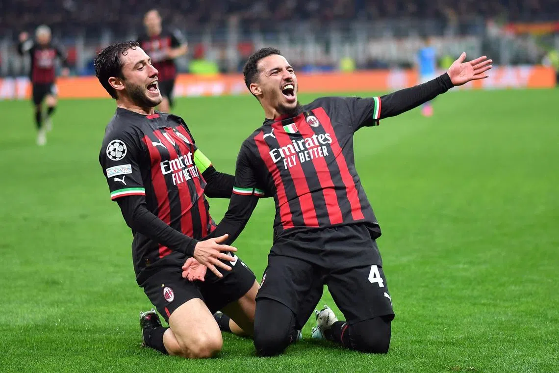 AC Milan's Ismael Bennacer celebrates scoring their first goal with Davide Calabria.