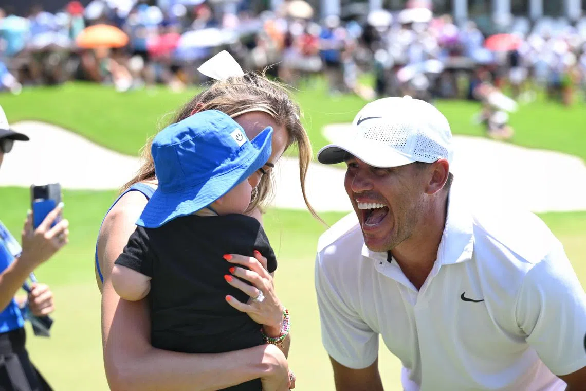 Slug: kkgolf05
ST PHOTO: Chong Jun Liang

Brooks Koepka celebrating with his son Crew Koepka and wife Jena Sims after winning the LIV Golf Singapore individual title on May 5, 2024.