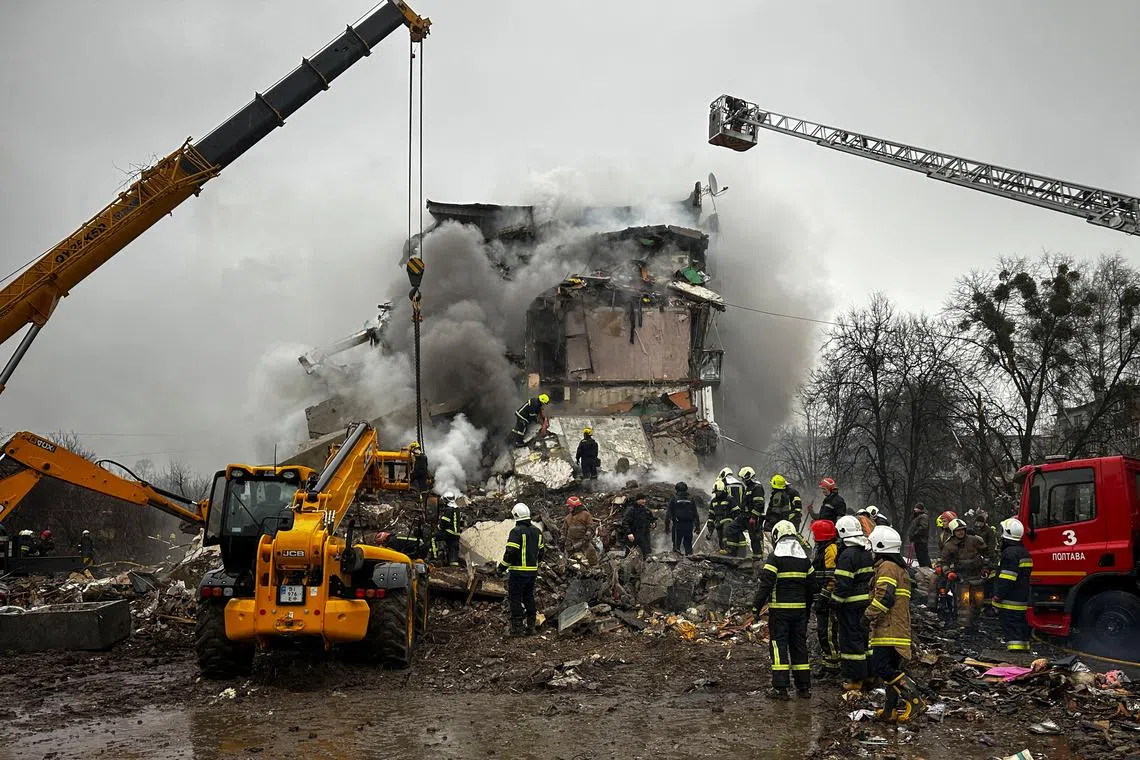 Rescuers work at the site of an apartment building hit by a Russian missile strike, amid Russia's attack on Ukraine, in Poltava, Ukraine February 1, 2025. REUTERS/Sofiia Gatilova