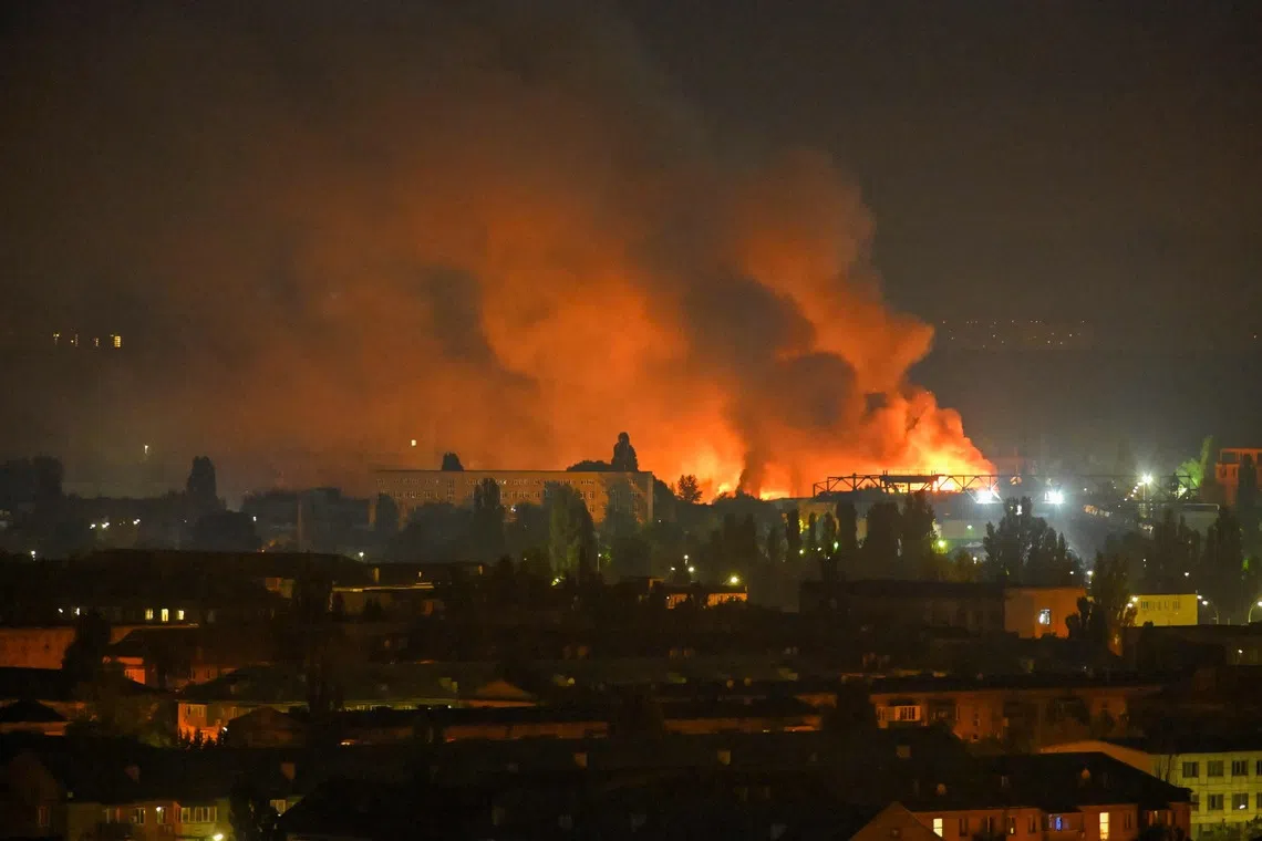 A fire breaks out following massive Russian ballistic missile strikes in the Ukrainian capital of Kyiv on Aug 5.