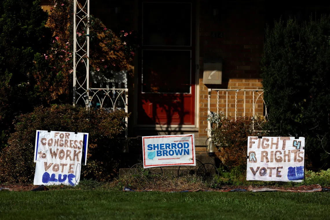 Signs in support of the Democratic Party and former US Senator Sherrod Brown (D-OH) in front of a home, as early voting begins in Ohio, in Warren, Ohio, US, October 7, 2026. REUTERS/Shannon Stapleton