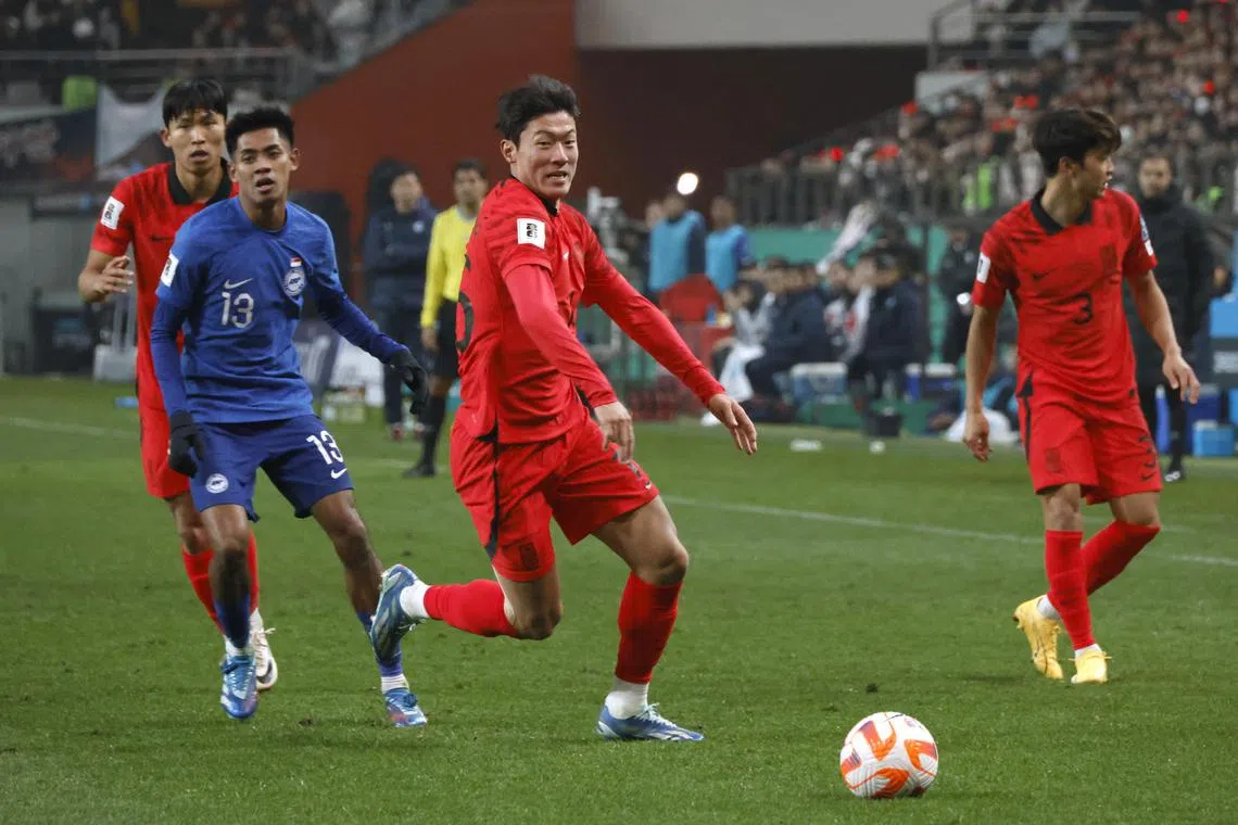 Hwang Ui-Jo battling for the ball during South Korea's 5-0 World Cup qualifying win over Singapore.