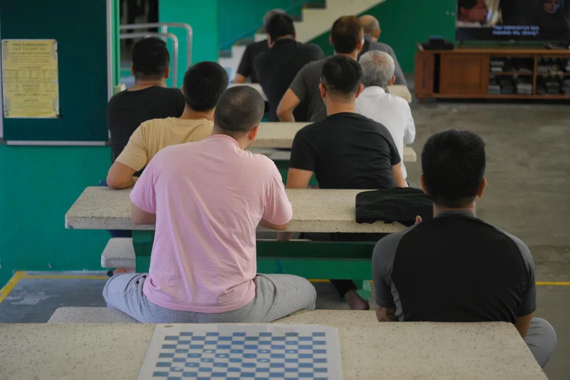 Residents watching a show on television at the Pertapis Halfway House on Tuesday.