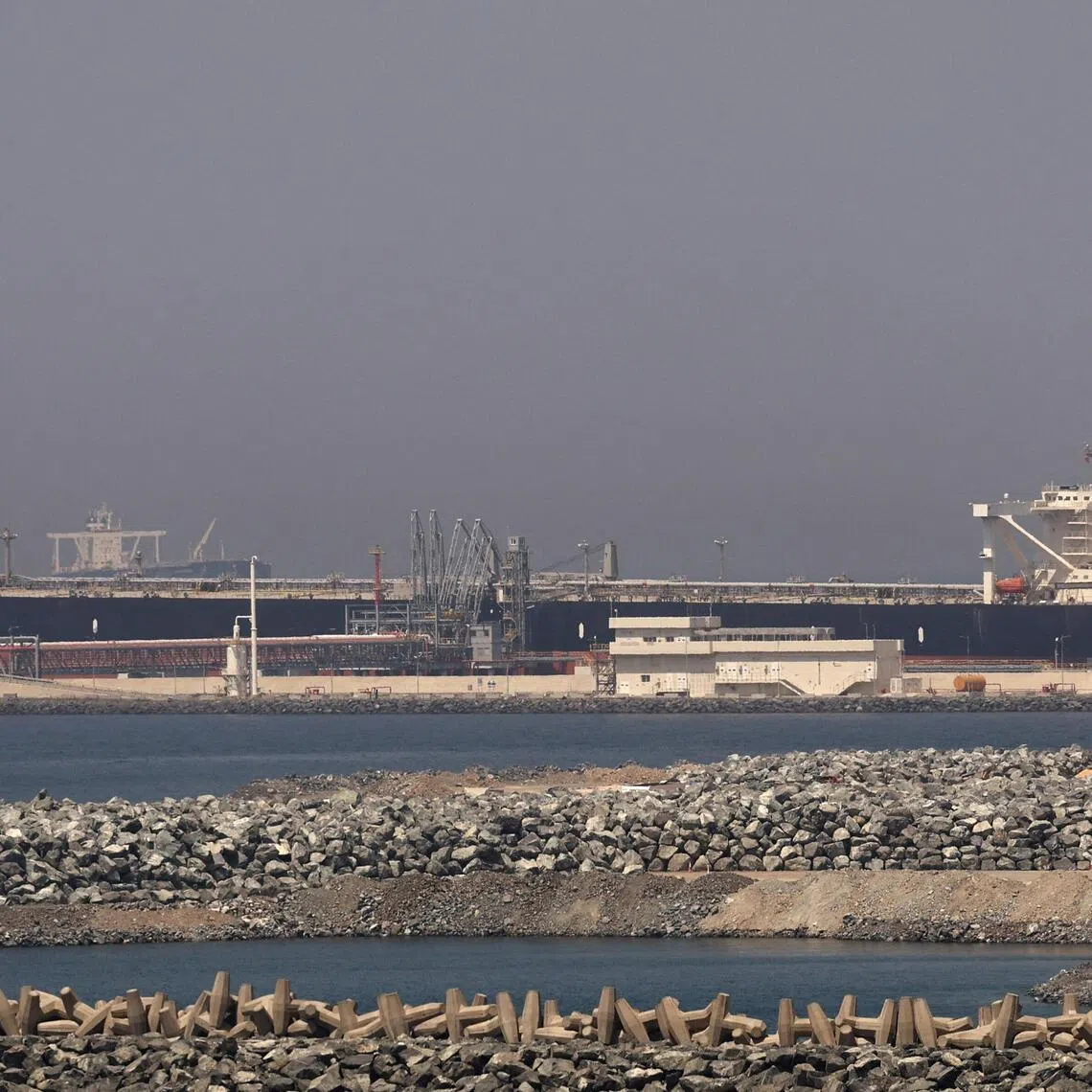 A cargo ship docked at the Port of Fujairah, as the US-Israel conflict with Iran limits marine traffic in the Strait of Hormuz, in Fujairah, United Arab Emirates, on May 6, 2026.