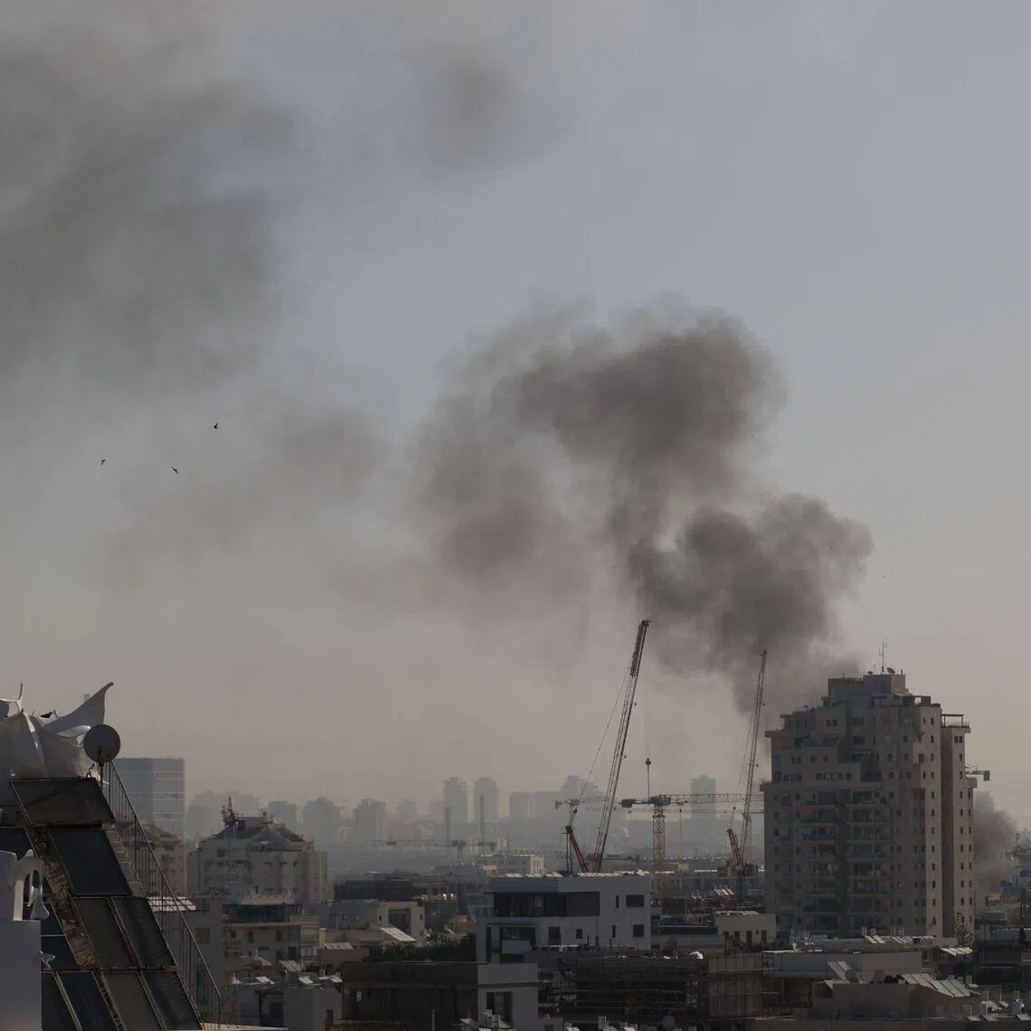 Smoke rises from an Iranian missile strike in Tel Aviv on March 23.