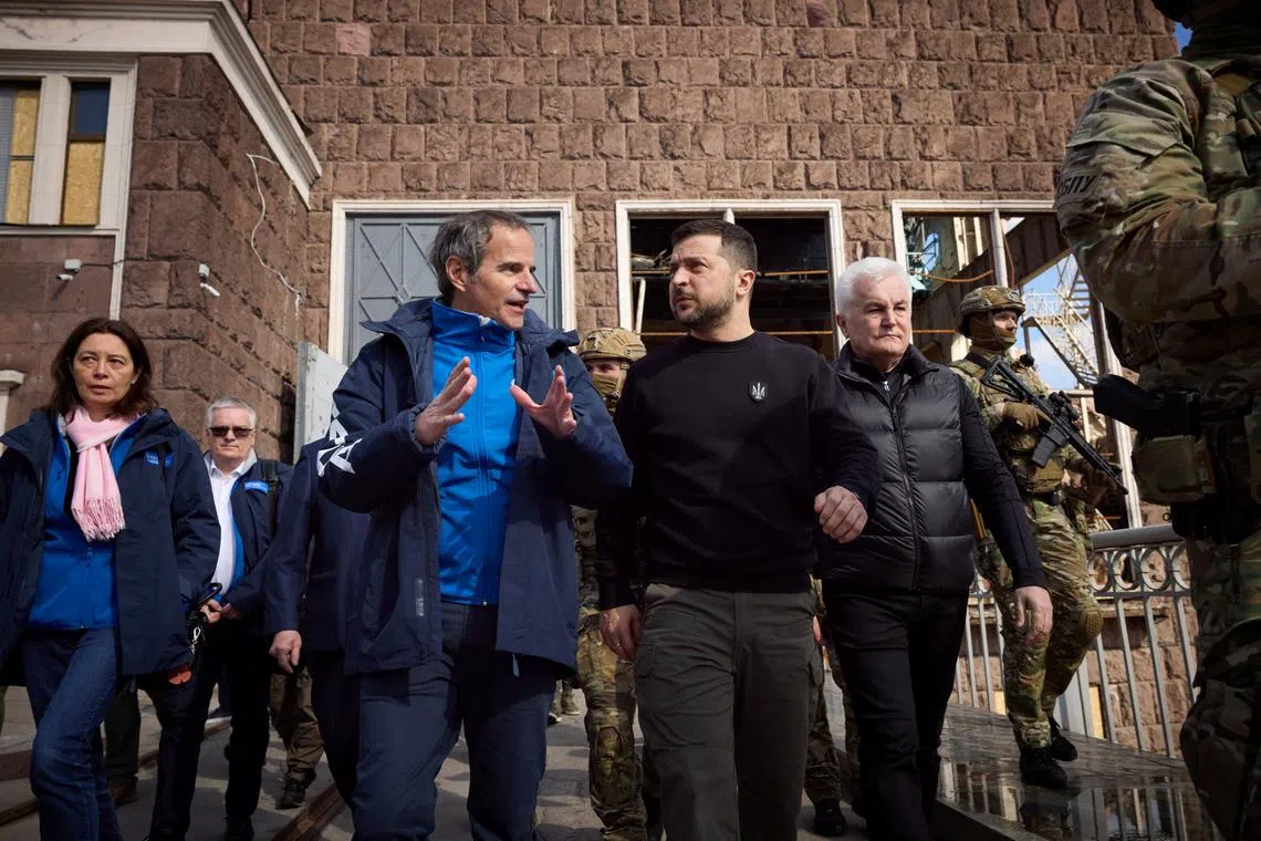 International Atomic Energy Agency (IAEA) Director General Rafael Grossi speaks to Ukraine's President Volodymyr Zelenskiy as they visit Dnipro Hydroelectric Power Plant, amid Russia's attack on Ukraine, in Zaporizhzhia, Ukraine March 27, 2023.  Ukrainian Presidential Press Service/Handout via REUTERS/ File Photo