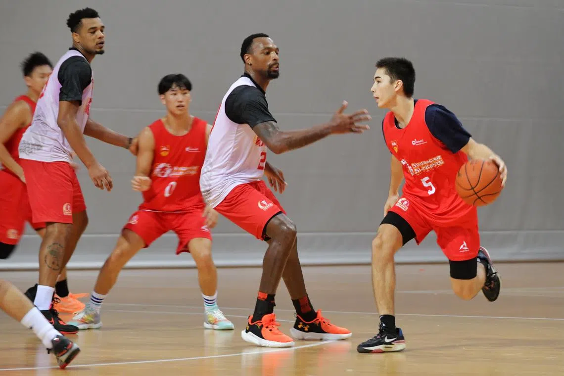 Zachary Helzer (right) training with the Singapore Slingers training at the OCBC Arena on Jan 10. 