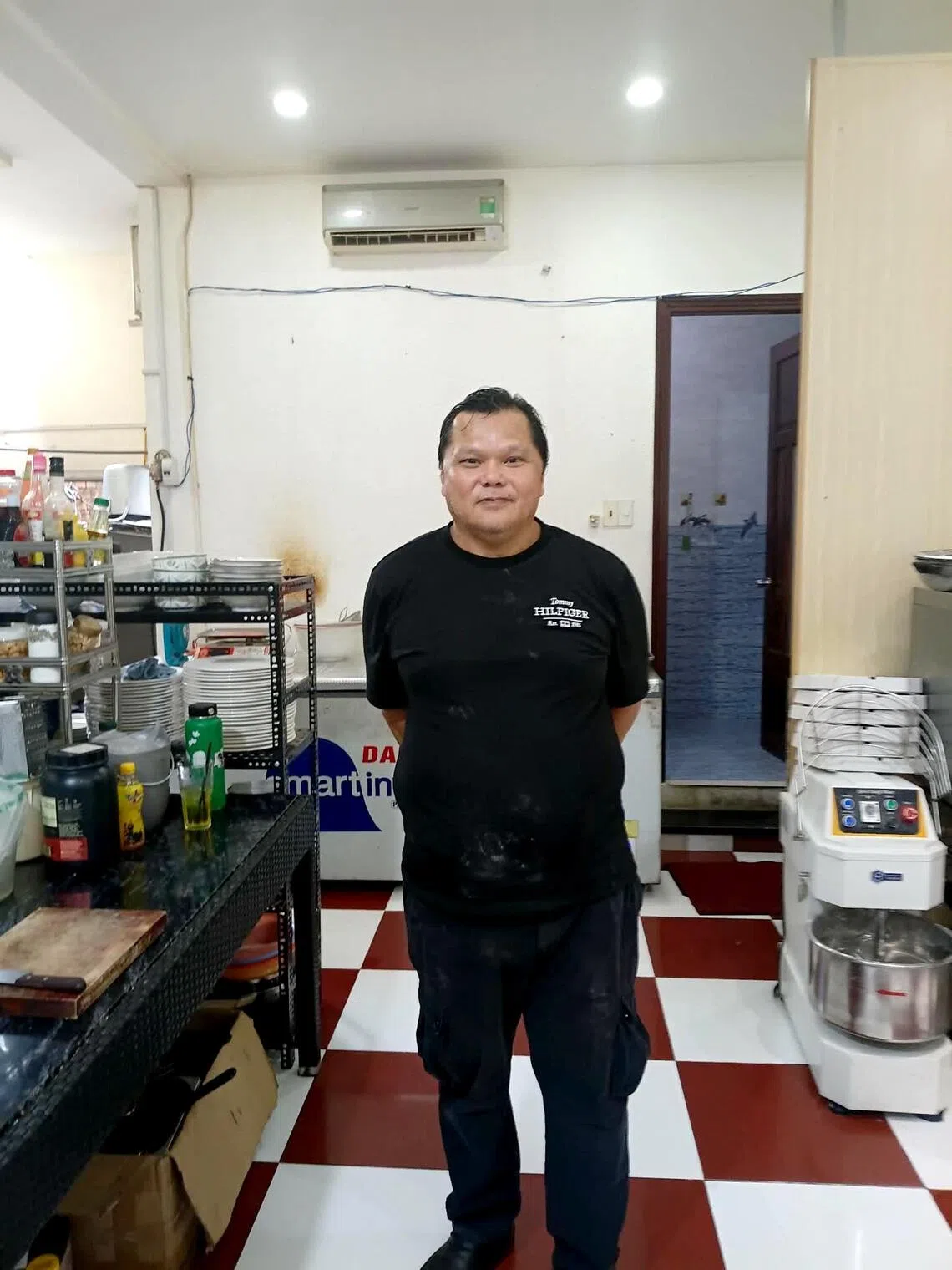 Andrew Fenton at his new workplace, a cafe in Vung Tau, a coastal city 100km from Ho Chi Minh City.