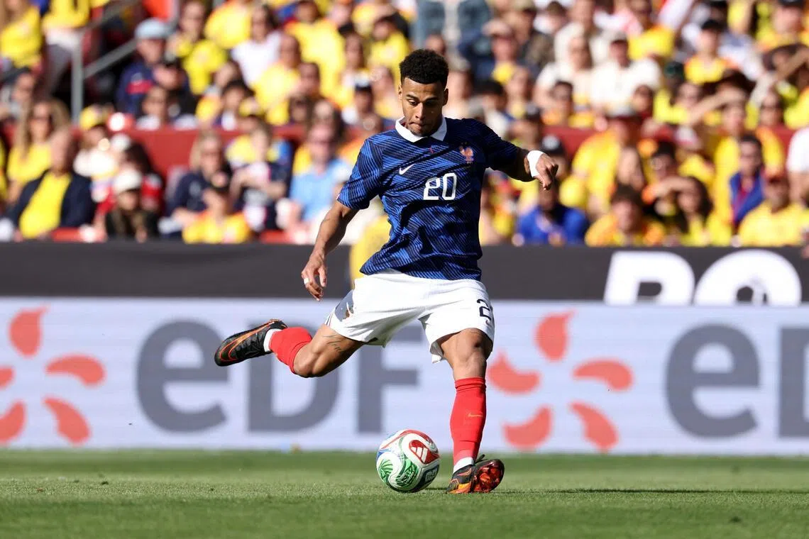 France's Desire Doue shoots to score his second goal on March 29, during a friendly football match against Colombia in the US.