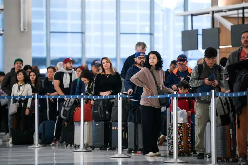 People wait in a security checkpoint line at George Bush Intercontinental Airport in Houston, Texas, on Nov 4.