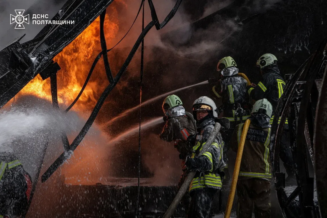 Firefighters work at the site where an energy infrastructure enterprise was hit during overnight Russian missile and drone strikes, amid Russia's attack on Ukraine, in Poltava region, Ukraine October 16, 2025. Press service of the State Emergency Service of Ukraine in Poltava region/Handout via REUTERS