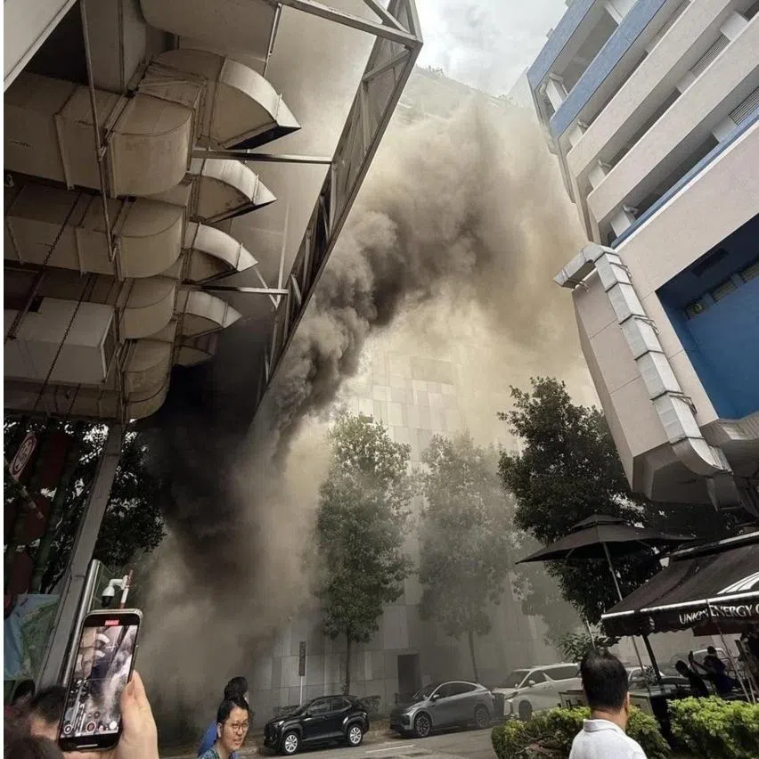 Smoke was seen coming from the Hong Lim Market and Food Centre building (left) in Upper Cross Street on Jan 2.